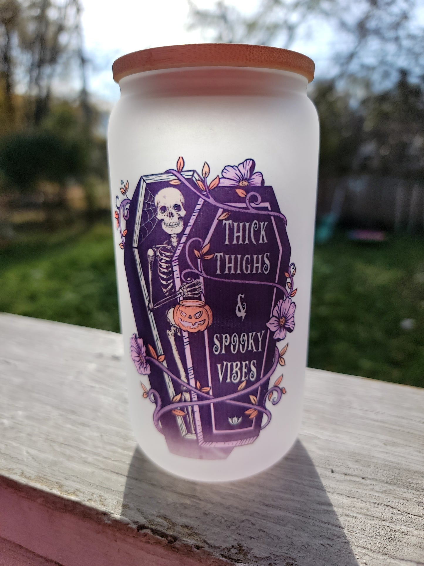 Thick Thighs & Spooky Vibes 16-ounce frosted glass tumbler